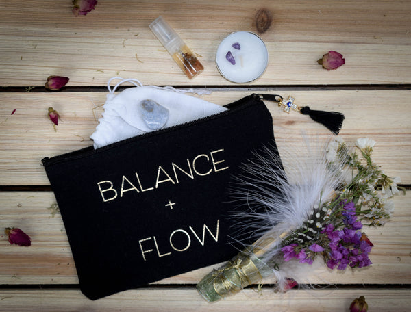 Rebalance and realign with our Balance + Flow energetic cleansing kit. This kit features all handmade products including: -1 Cosmetic bag with evil eye charm -1 Palo Santo floral smudge stick -1 Rose oil mini spray bottle -1 Crystal infused tea light candle -1 Healing crystal -1 Daily mantra