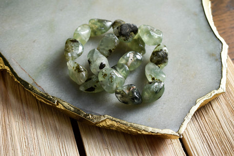 These tumbled Prehnite beads create a beautiful statement bracelet. Wear alone, or stack them for a fun and flirty look!