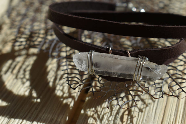 Handmade wire-wrapped quartz and leather wrap bracelet. This hand-picked quartz crystal acts as an energetic cleansing stone. Quartz enhances your connection to source, and keeps your chakras in alignment, helping to clear out any lower vibrations or frequencies. 