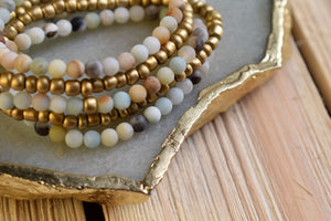Mix + Match our healing crystal stretch bracelets! Perfect for stacking with other beaded bracelets, wraps, or watches - the possibilities are endless! Amazonite is a calming stone, and possesses the ability to soothe the nervous system. It is said to be able to diffuse intense situations by increasing the vibration of love. With its blue color, it is related to the throat chakra, thus enhancing one's ability for clear communication, and increases the ability to communicate from a place of love.